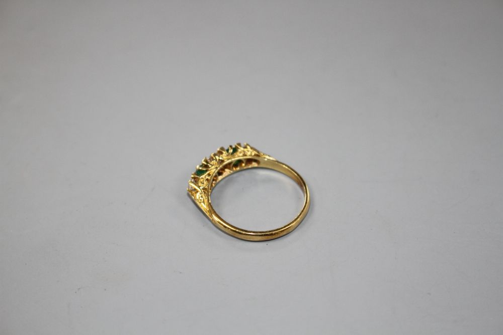 A modern Victorian style 18ct gold, two stone emerald and three stone diamond set half hoop ring,